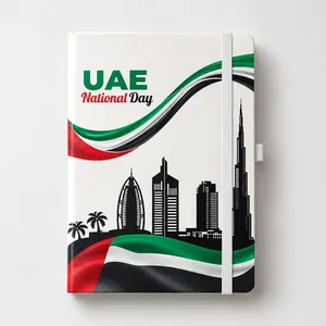 Notebook with a white cover printed UAE National Day, a flag ribbon and a city skyline